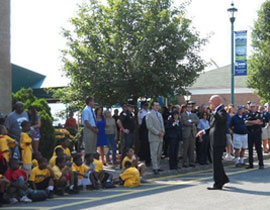 Supervisory Special Agent/Resident Agency James Gagliano preparing the crowd for FBI chopper arrival